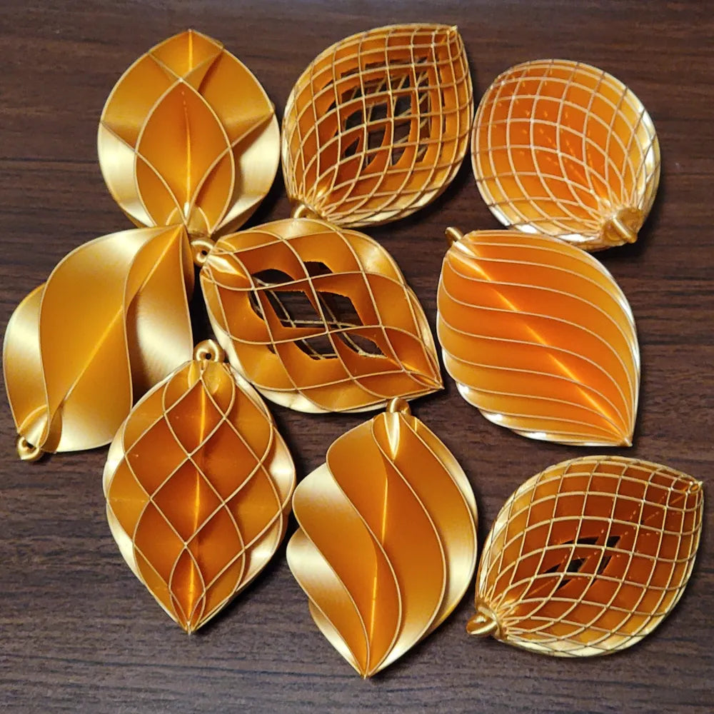 Pack de 6 espirales navideños 3D en color dorado con distintos diseños calados y en espiral