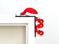 Adorno navideño para esquina de puerta HO HO HO 3D con gorrito de Papá Noel rojo y blanco sobre marco negro