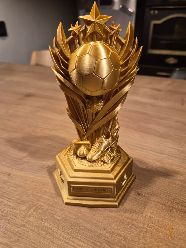 Trofeo fútbol estrellas y alas dorado personalizable impreso en 3D con base hexagonal