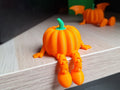 Calabaza articulada 3D con patas móviles naranja y verde - 7cm Halloween