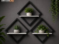 Set x3 estantes rombo 3D negros con blancos instalados en pared gris con plantas decorativas